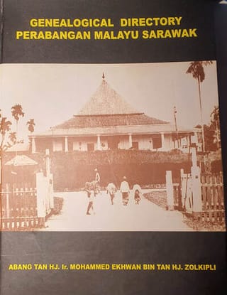 Kulit buku Genealogical Directory Perabangan Malayu Sarawak dengan foto lama rumah tradisional